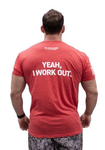 Model wearing "Yeah, I Work Out" Crew Neck T-Shirt, showing text on back.